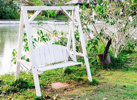 Wooden white swing photo