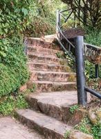 Stone staircase with the steel banister. photo