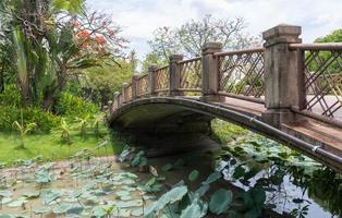 Arch concrete bridge with the metal rail. photo