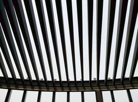 The metal grille roof on the rooftop of the modern building with the sunlight. photo