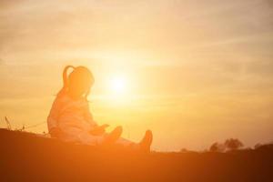 kid silhouette,Moments of the child's joy. On the Nature sunset photo