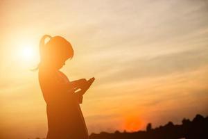 kid silhouette,Moments of the child's joy. On the Nature sunset photo