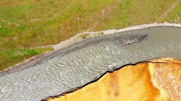 Aerial view of truso gorge in KAzbegi with river slow views in spring and summer greenery video