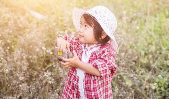 little girl photographs flower outdoor photo