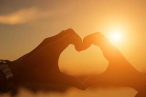 hands in shape of love heart photo