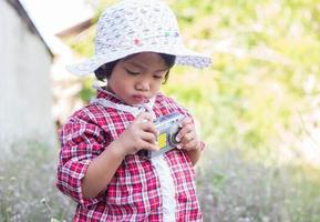 little girl photographs flower outdoor photo