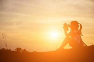 kid silhouette,Moments of the child's joy. On the Nature sunset photo