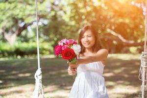 Flowers in woman hand photo