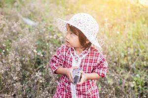 little girl photographs flower outdoor photo