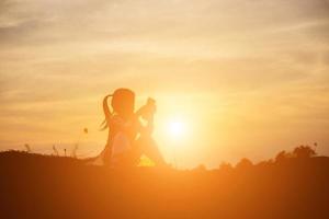 kid silhouette,Moments of the child's joy. On the Nature sunset photo