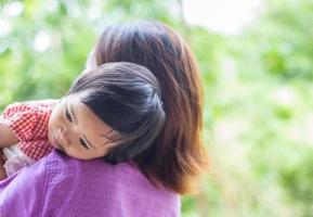 Mother holding her daughter photo