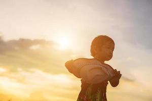 kid silhouette,Moments of the child's joy. On the Nature sunset photo