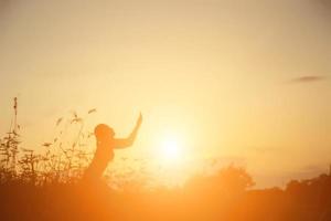 Young woman raise hands up for her success, Concept of Success in life. photo