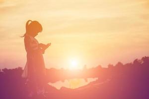 kid silhouette,Moments of the child's joy. On the Nature sunset photo