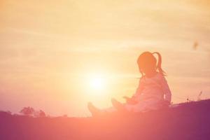 kid silhouette,Moments of the child's joy. On the Nature sunset photo