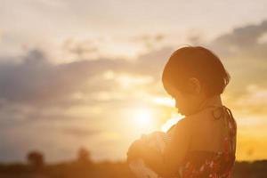 kid silhouette,Moments of the child's joy. On the Nature sunset photo