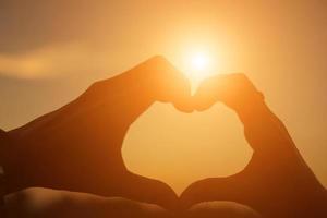 hands in shape of love heart photo