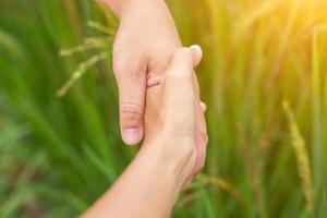 Hand of Young Woman Enjoying Nature with sunrise. photo