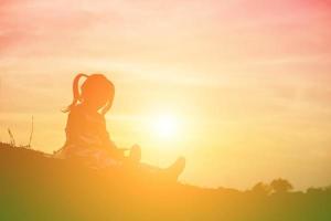 kid silhouette,Moments of the child's joy. On the Nature sunset photo