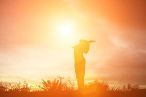 kid silhouette,Moments of the child's joy. On the Nature sunset photo