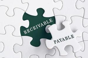 Receivable and payable text on Jigsaw Puzzle. Accounting concept photo