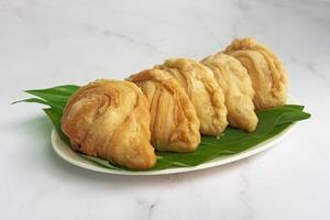 Malaysia popular and traditional snack Karipap filled with potato fillings. photo