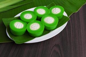 Nona Manis is a steamed pandan-flavoured kuih with a creamy center filling. photo
