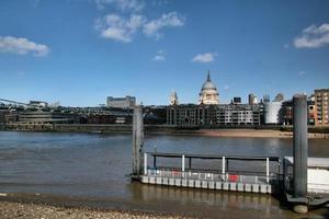 A view of St Pauls Cathedral across the river Thames photo