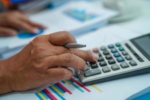 Pen on chart or graph paper. Financial, account, statistics and business data concept. photo