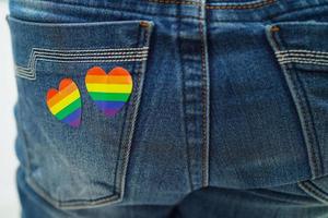 Asian woman with rainbow flag, LGBT symbol rights and gender equality, LGBT Pride Month in June. photo