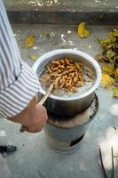 A close up shot of turmeric root being boiled in a big pot . Turmeric is a common spice that comes from the root of Curcuma longa. It contains a chemical called curcumin, which might reduce swelling.