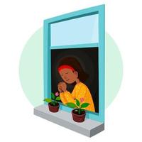 niña rezando en la ventana