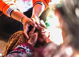 Close up hands of helping hands elderly home care. Mother and daughter. Mental health and elderly care concept photo