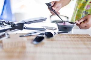 Close-up of hairdressing tools on a wooden table. photo