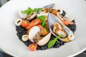 Italian Riso Pasta Tossed in Black Squid Ink photo