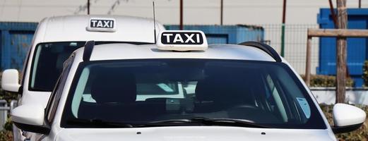 Taxi car waiting for customers. Transportation of passengers. Bologna, Italy. photo