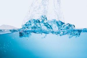 blue sea waves stopped steaming with separate bubbles on a white background. Popular corners, natural concepts photo