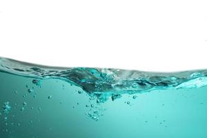 Spectacular ocean waves stop steaming with separate bubbles on a bright sky background. Popular corners, natural concepts photo