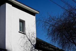 Windows and roof of old house photo