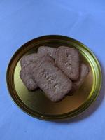 Sugar Topping biscuits on a golden plate photo