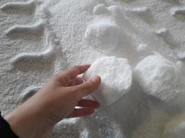 Urea chemical fertilizer, white foam granules, agglomerate In the hands of farmers photo