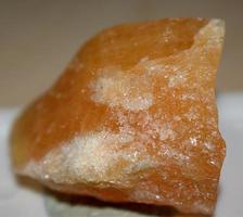Yellow calcite crystal detail common mineral sample composed by calcium photo
