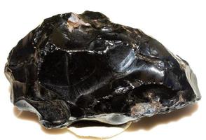 Obsidian black rock sample of volcanic cold lava mineral generated photo