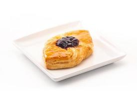 Delicious Danish pastry on white background photo