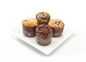 Delicious muffins on white background photo