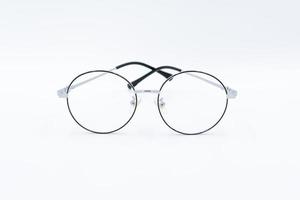 Isolated white background, Selective focus round eyeglasses with silver rim. photo