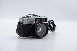 Isolated white background Beautiful vintage analog rangefinder film camera. 70's Decade film camera. Front right view image. photo