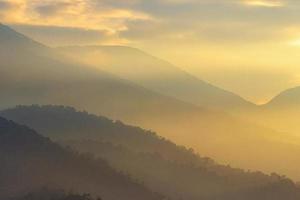 morning view on the mountain range in yellow photo