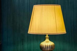 table lamp in front of modern green wall interior design photo