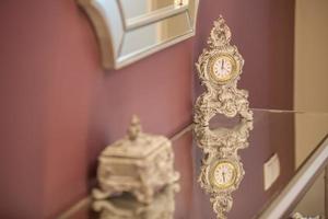 antique clock on the table interior design photo